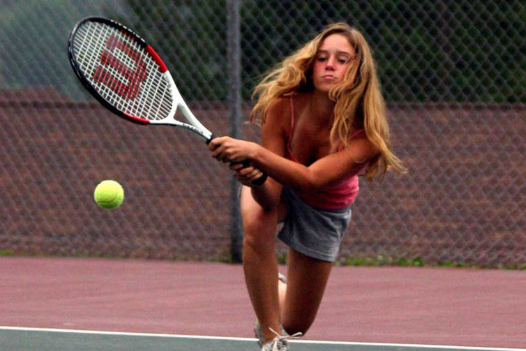 Tennis instruction at French Woods Festival A camper on our tennis courts
